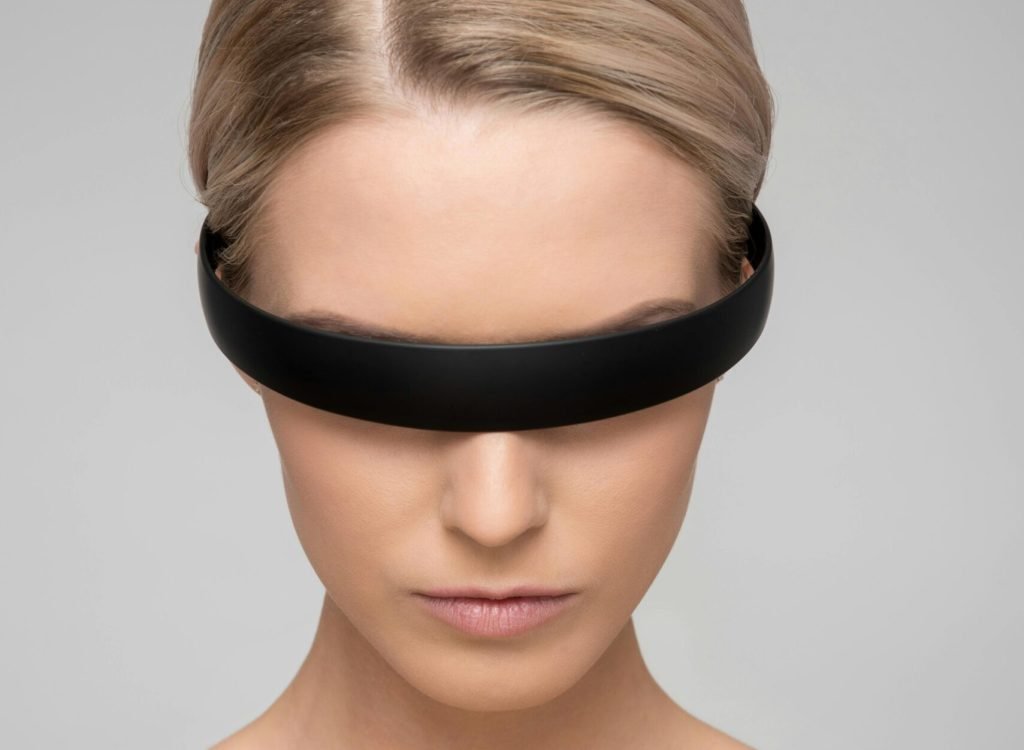 pexels-photo-1036642-1036642 A captivating portrait of a woman with a sleek VR headset, depicting a futuristic theme.